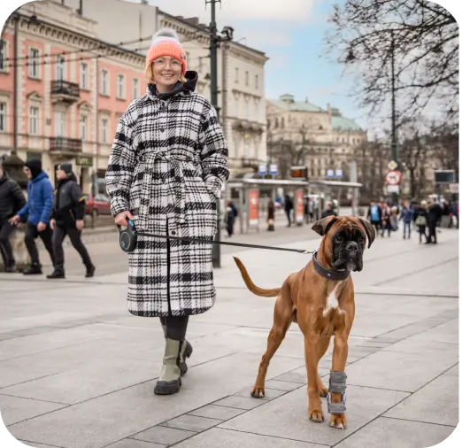 woman with a dog on a walk