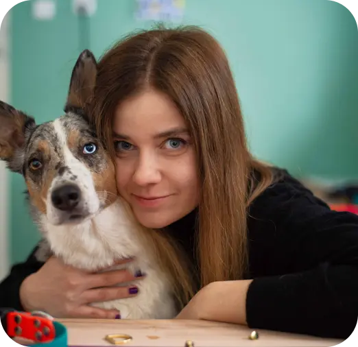 woman hugging a border collie dog