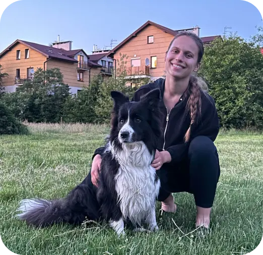 a girl with his dog on a green grass